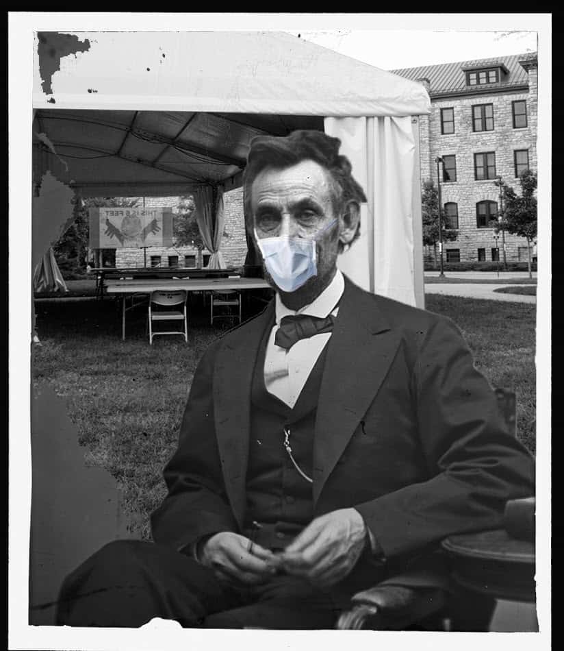 satirical image of Abraham Lincoln in a mask near a tent on the KU campus