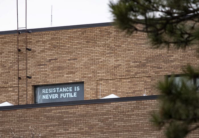 letters in an upper window of Chalmers Hall say, Resistance Is Never Futile