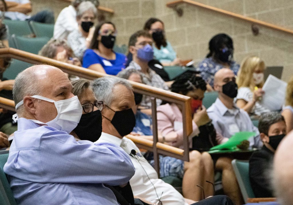 participants wear masks while sitting in Budig lecture hall
