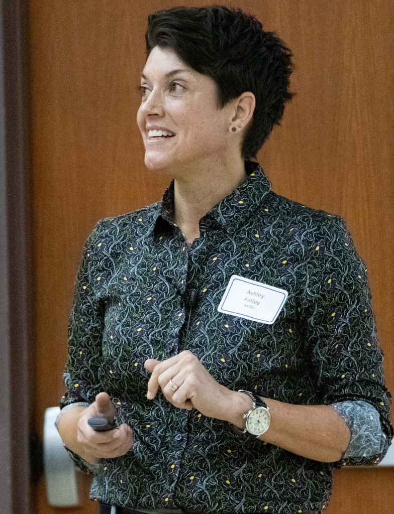 Ashley Finley smiles as she listens at the 2021 Teaching Summit